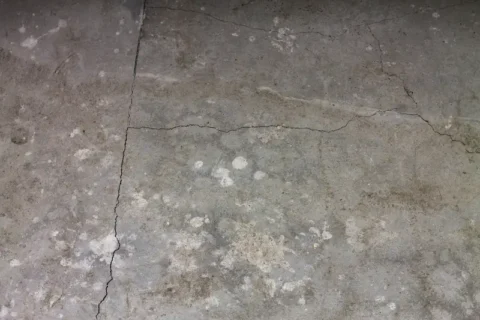 A cracked concrete basement floor in a Milwaukee, WI area home